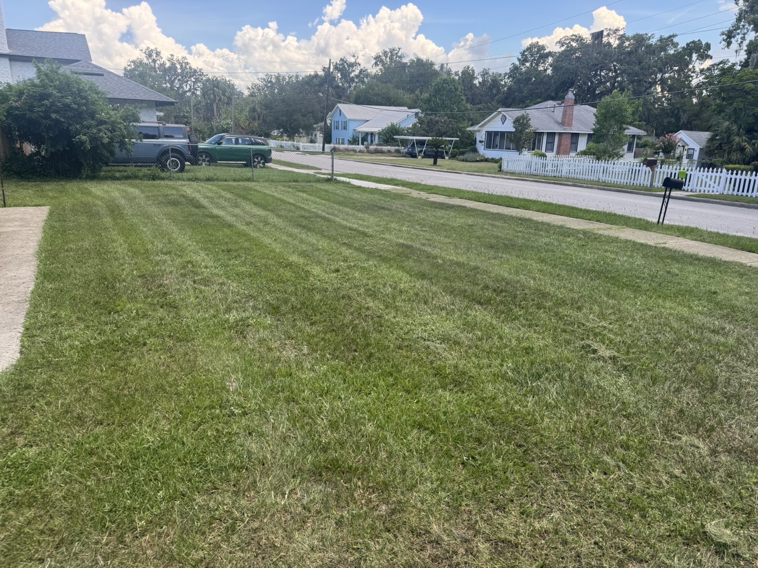 Clean green yard beside a home